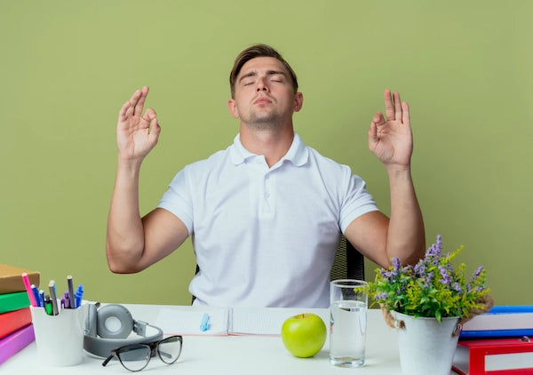 Man practicing mindfulness meditation at a desk.